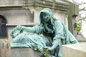 Memorial statue or gravestone - Paris, France 2022 photo