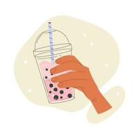 Flat vector illustration of a hand holding cold Taiwanese tea with milk and tapioca in a plastic cup. Isolated design on a white background. Vector stock illustration.