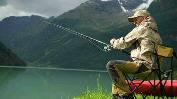 Caucasian Men Fly Fishing on the Scenic Glacial Lake video