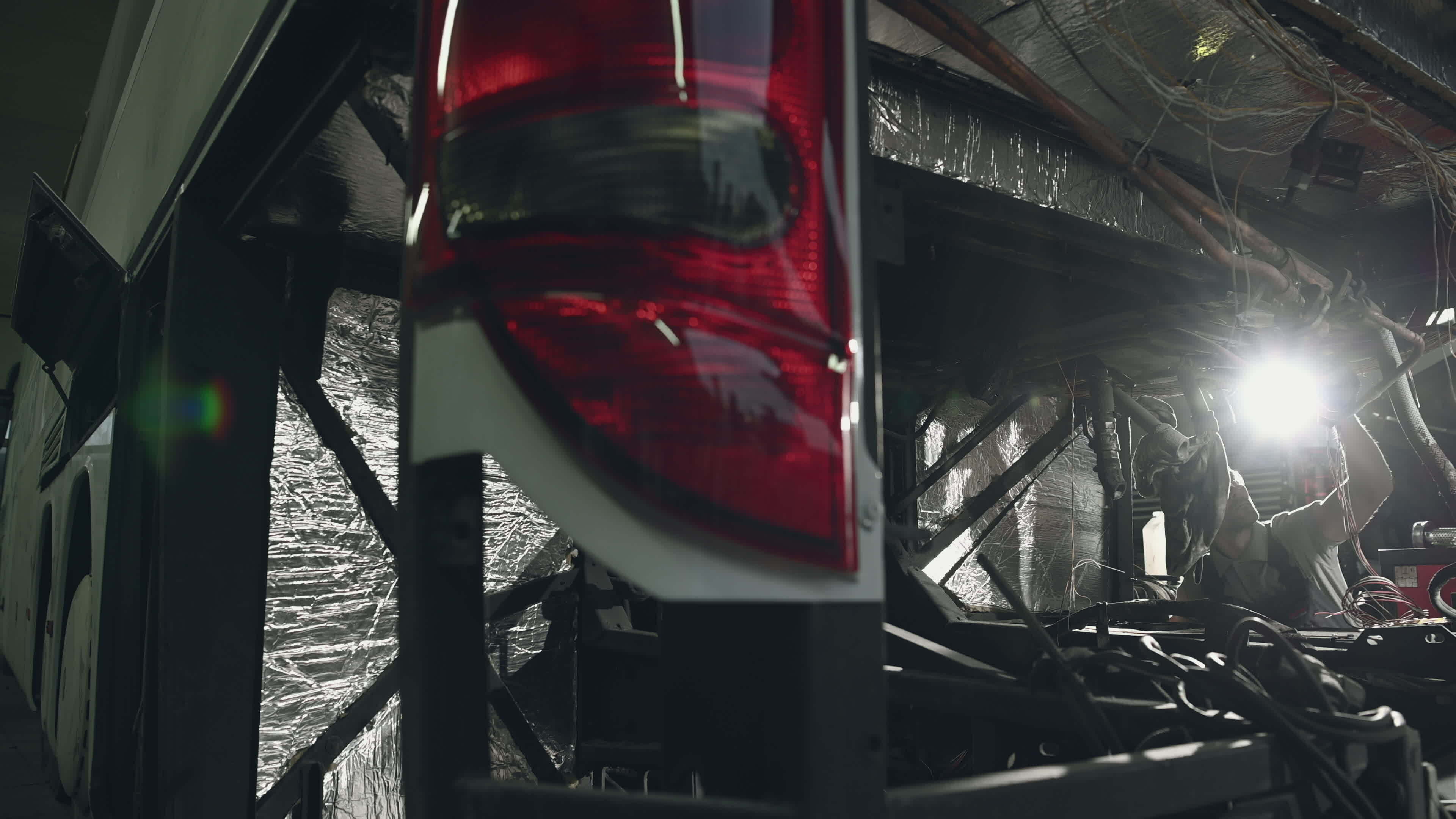 Mechanic Working On Electrical Wires In Broken Bus. 24242259 Stock