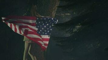 Young Female Child Twirling Around Slowly With Large American Flag Floating Behind. video