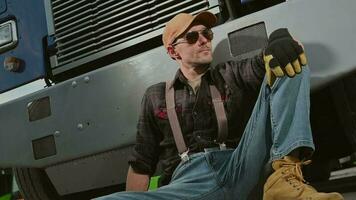 Man Sitting In Front Of Semi Truck. video