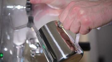 Italian Barista Steaming Milk For the Cafe Latte. Closeup Video