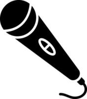 Isolated microphone icon in glyph style. vector