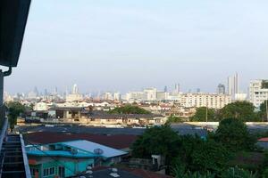 no clouds sky and the city building below background photo