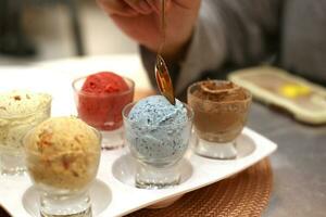 close up colorful icecream shot scoop on salver tray photo