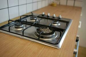 mock up gas stove in the minimal style kitchen with white and brown color photo