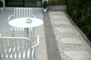 minimalist style sitting in the cafe shop with white and brown tone photo