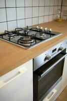 mock up gas stove in the minimal style kitchen with white and brown color photo