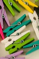 Colorful clothespin on white background photo