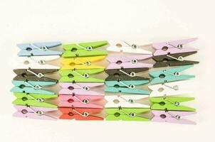 Colorful clothespin on white background photo