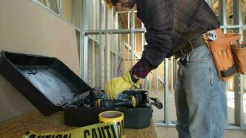 Caucasian Construction Worker Preparing His Tools For the Job video