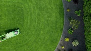 Aerial View Of Man Cutting Grass. video