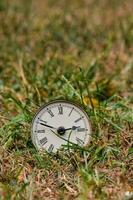 Clock on the grass photo