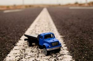 Toy truck on the road photo