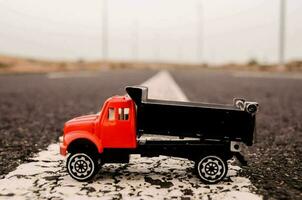 Toy truck on the road photo