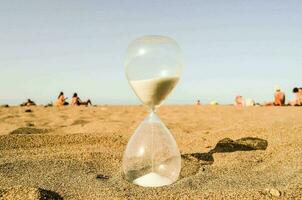 Hourglass on the beach photo