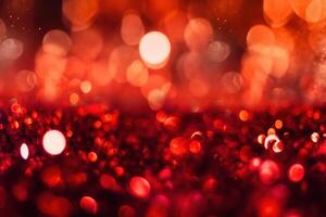 Abstract Christmas background with bokeh defocused lights and red color. photo