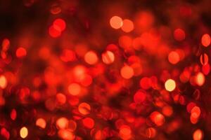 Abstract Christmas background with bokeh defocused lights and red color. photo