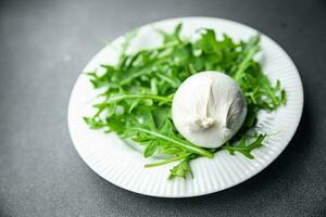 buratta salad green leaves arugula cheese burratina healthy meal food snack on the table copy space food background rustic top view photo