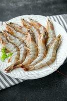 raw shrimp gambas prawn seafood meal food snack on the table copy space food background rustic top view photo