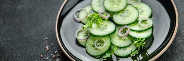 cucumber green salad fresh vegetable meal food snack on the table copy space food background rustic top view photo