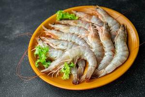 raw shrimp gambas prawn seafood meal food snack on the table copy space food background rustic top view photo