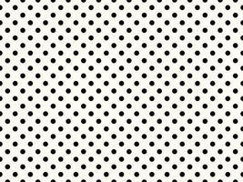 black polka dots over snow background photo