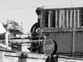 abandoned factory ruins in black and white photo