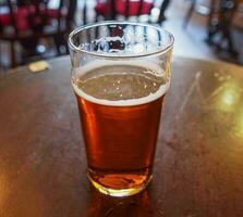 british ale beer pint in pub photo