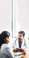 Cropped Image of Male and Female Doctors Sitting at Workplace in Hospital, Vertical Banner Design, . photo