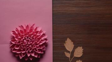 Top View of Pink Paper Card Mockup with Beautiful Dahlia Flower on Wooden Table, . photo