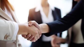 Cropped Image of Business handshake between two women Inside a modern bright office. . photo