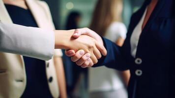 Cropped Image of Business handshake between two women Inside a modern bright office. . photo