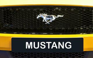 Nonthaburi Thailand 6 December 2022 Close up logo Ford Mustang on yellow car photo