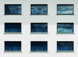 Pattern blue window glass on hotel buliding photo