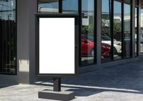Outdoor pole LED display billboard with mock up white screen on footpath. clipping path for mockup photo