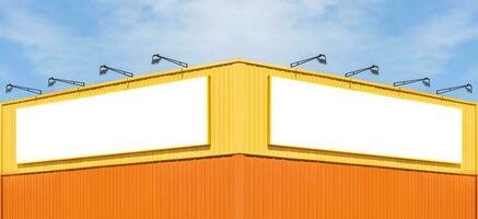Mock up white background billboard on yellow building with blue sky background photo