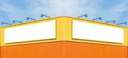 Mock up white background billboard on yellow building with blue sky background photo