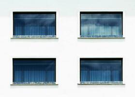 Pattern blue window glass on hotel buliding photo