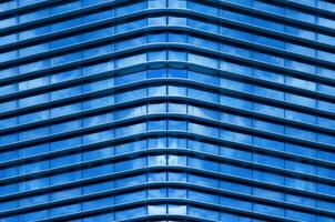 Modern office building with blue glass window photo