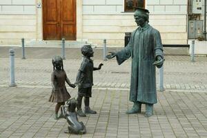 Alba Iulia , Romania - May 1 2023 , The multitude of statues made of bronze that can be found near the center of the fortress.This statues present different status of the people back days photo