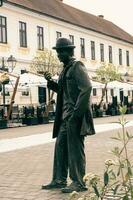 Alba Iulia , Romania - May 1 2023 , The multitude of statues made of bronze that can be found near the center of the fortress.This statues present different status of the people back days photo