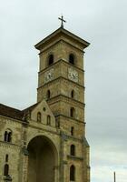 Saint Michael's Roman Catholic Cathedral in Alba Iulia immortalized from different angles photo