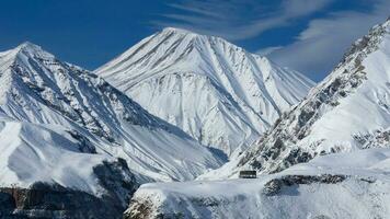 View of Caucasian Mountain in winter. Cross Pass in Georgia. Gudauri District. Source of Aragvi River photo