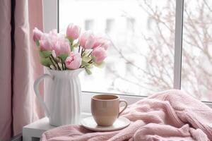 Spring is still alive. Cup of coffee with pink crochet. photo