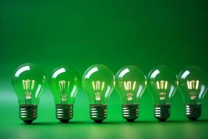 Idea concept on light bulb hanging on green background, photo