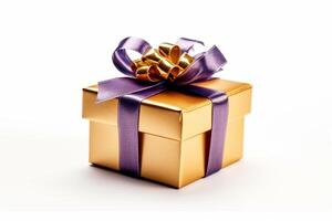 Golden gift box with purple ribbon isolated on a white background. photo