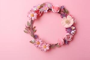 Different tiny flowers in a bouquet on a pink background with copy space. Flat layout with text space. Romantic feminine flatlay, photo