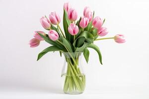 Pink tulip flowers in vase isolated on white background. photo